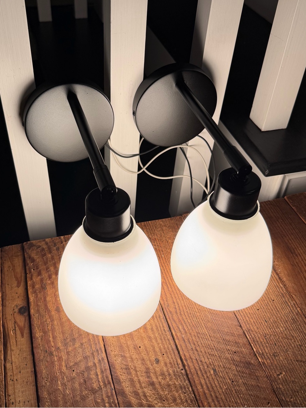 Pair of adjustable swivel/pivot black wall-mount lamps with frost white glass